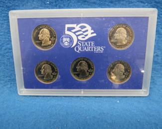 Lot 105. Five 1999 US Mint Silver Proof State Quarters. Each coin weighs 6.25 grams and contains .900 silver