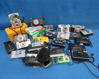 Lot 242. Point and Shoot Cameras Including Kodak Instamatic, Kodak Brownie, Kodak Disc, and More