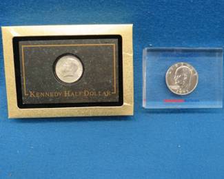 Lot 88. 1964 Kennedy Half 1971 Eisenhower Dollar paperweight