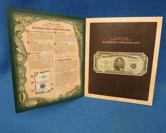 Lot 179. One Series 1953 $5 Silver Certificate displayed in a folder entitled America's changing Currency
