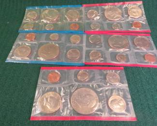 Lot 27. Two and a half 1976 US Mint Uncirculated Coin Sets. Two sets each contain Denver and Philadelphia packets of coins. One set only has the red packaged Denver coins.