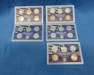Lot 95. Five State Clad Quarter Sets with 5 quarters each: 1999, 2000, 2001, 2002 and 2003.