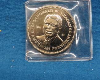 Lot 190. 1984 Ronald Reagan Series AA "Double Eagle" Commemorative coin "layered in pure .999 Silver" with a COA.