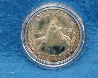 Lot 199. 1998 S US Mint Olympic $1 coin in a display case. No COA or gold coin