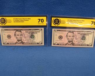 Lot 71. Two $5 2006 Federal Reserve Star Notes both Fr #1922A Cabral-Paulson and graded by CEC as Perfect New.