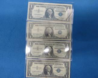 Lot 148. Four 1957 $1 Silver Certificates