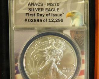 Lot 18. 2020 American Silver Eagle First day of issue containing 1 oz. pure silver graded by ANACS-MS70 II in an attractive wooden display box.