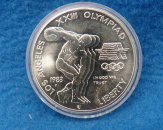 Lot 60. Commemorative 1983 Olympic Silver Dollar made with 24.06 Grams of 900 fine silver.
