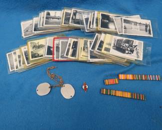Lot 228. World War 2 items including photos in plastic sleeves, dog tags, and more