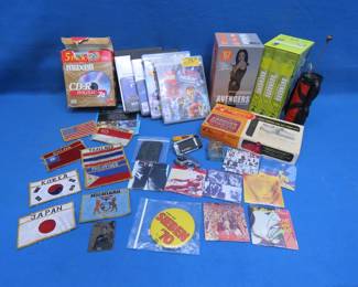 Lot 243. Rolling Stones Mini Albums, Playstation 3 Games, Avengers TV Show VHS, Flag Patches, and More