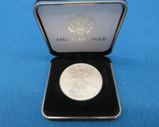 Lot 108. 2001 American Eagle one oz. fine silver coin in an attractive display box