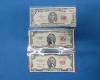 Lot 138. One $5 and two $2 Red Seal Dollar Bills