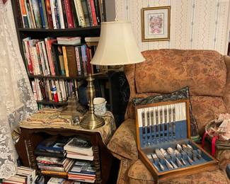 Lots of silver plate flatware, books,  recliner