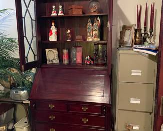 Beautiful Reproduction Secretary next to an ugly file Cabinet.   Look how far we have come through the ages 🤣