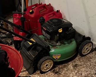Lawn mower, gas cans.