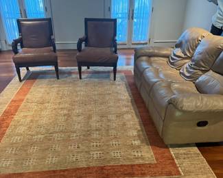 Living Room set with handmade rug and leather sofa