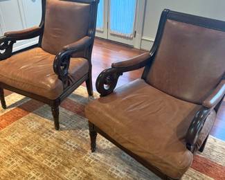 pair of leather and mahogany chairs