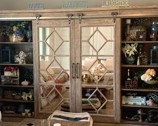 Beautiful wall unit with sliding doors and heavy metal hardware