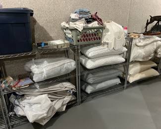 lots of bedding, pillows, blankets, comforters, sheets, etc.