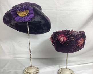BIHY104 Edwardian Victorian Purple Velvet Hats Two Edwardian Victorian purple velvet hats. The first hat was made by Patrician Hats in New York. The second hat was made by C. Lothrop Higgins out of Boston, Massachusetts, and features purple floral designs.
