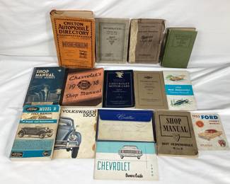 BIHY111	A collection of vintage automotive books. Includes a care and operation manual for a Studebaker, an informational book on a "Twin Six" 1-35 and 1-25 automobile, a vintage copy of Automobile Upkeep and Care written by Harold P. Manly and illustrated by Frederick J. Drake, and other books from various manufacturers and cars.

