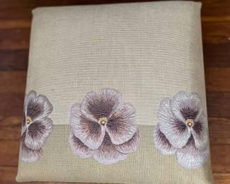 Needlepoint cover on foot stool