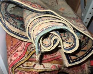 Rugs stashed in basement.