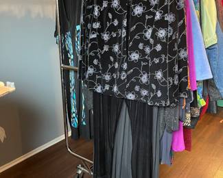 Many gorgeous women’s plus plus sized garments, many new with tags. 
