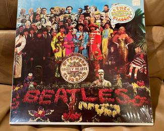 New in wrapper Beatles St. Peppers Lonely Hearts Club Band LP. Unopened copy.