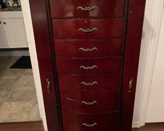 Queen Anne style jewelry chest with eight drawers and two side panels that swing out for hanging longer necklaces.
