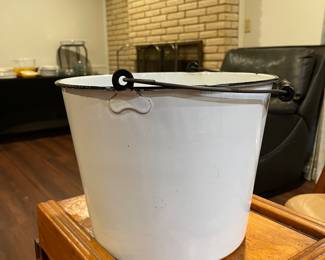 French enamel bucket with black wooden handle. 