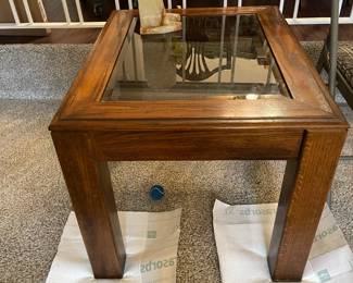 Oak side table with beveled glass top.