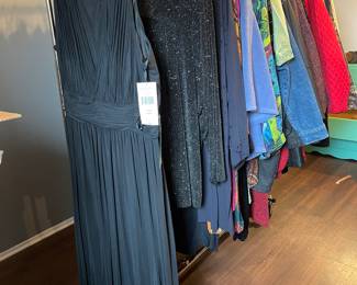 Many gorgeous women’s plus plus sized garments, many new with tags. 