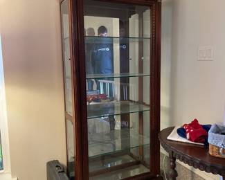 Fluted column, engraved walnut curio cabinet.