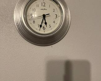 Silver Art Deco style Seth Thomas wall clock with sweeping second hand.