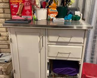 Rolling kitchen storage and workspace cabinet with two drawers.