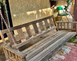 Swinging porch bench with chains