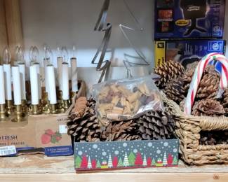 Candles and baskets and pine cones