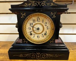 Vintage Ansonia 1800's (lion heads) mantle clock in working order.