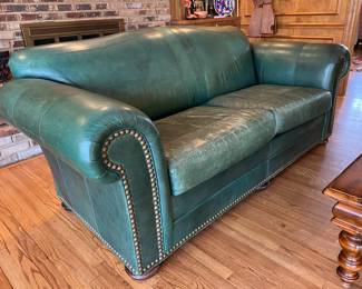 Pair of green leather sofas