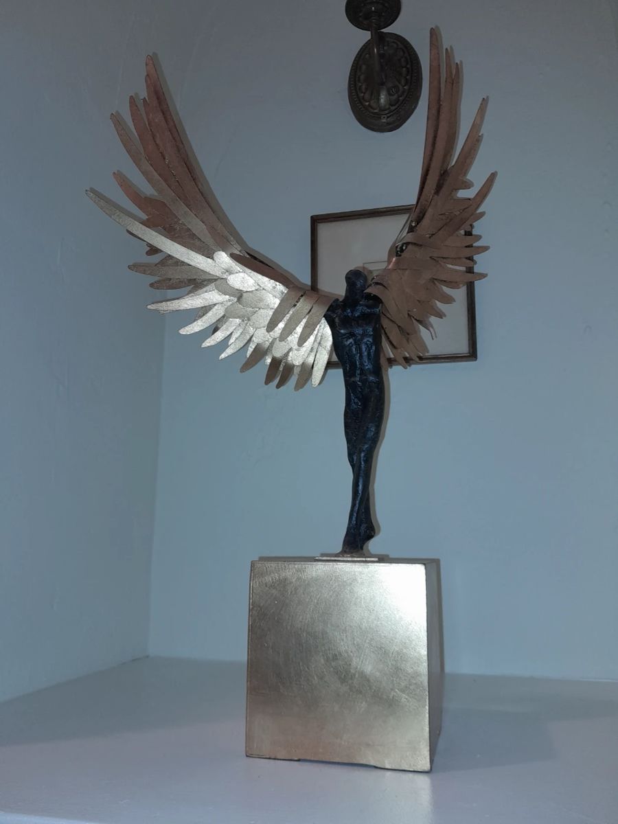 Avian Man cast iron sculpture with bronze finish and gold leaf