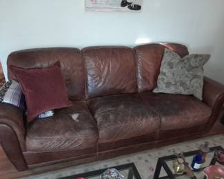 Man cave leather sofa - patch it priced