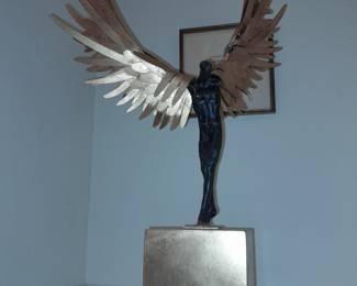 Avian Man cast iron sculpture with bronze finish and gold leaf