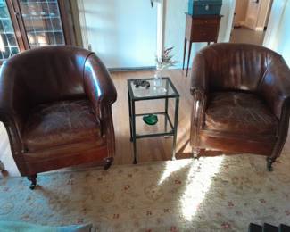 Club chairs with nail heads and casters