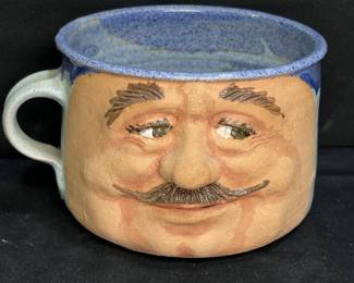 2 Signed large ceramic face mugs