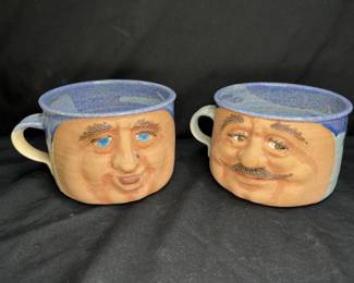 2 Signed large ceramic face mugs