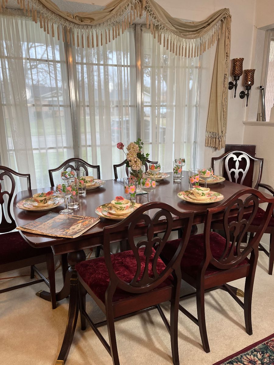 The antique mahogany dining table seats 6 people without its leaf. 62x40x11 without leaf