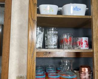 This cabinet is filled with vintage items. The vintage 1950's red rooster juice glasses are by Libby.