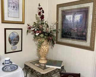 The end table in this picture matches the coffee table seen in previous pictures. sitting beside the end table is an antique mahogany magazine rack.