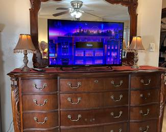 The triple mahogany dresser in the master bedroom has 12 drawers and measures 74"w x 20"d x 40"h. It has a detachable beveled mirror that is 46" h x 57"w.